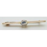A 9ct gold broach set with a moonstone cabochon