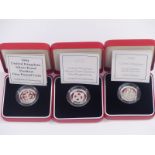 Three cased Royal Mint silver proof Piedfort one pound coins, 1994, 2001 and 2002, with