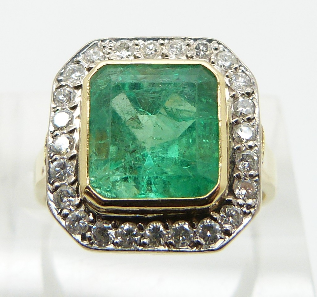 An 18ct gold ring set with an emerald cut emerald approximately 3.3ct surround by diamonds, size N - Image 2 of 3