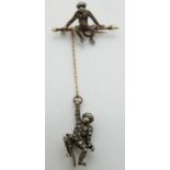 Victorian brooch depicting two monkeys, one hanging from the other, set with paste