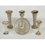 Five various Victorian and later hallmarked silver trumpet vases including a pair of embossed