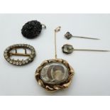 Victorian mourning brooch set with plaited hair, paste buckle, jet brooch and two stick pins