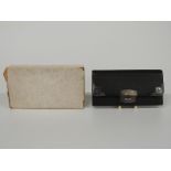 George V hallmarked silver mounted leather purse, London 1911 makers' mark HT, length 11.5cm, in