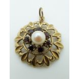 A 9ct gold pendant set with a pearl and garnets