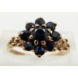A 9ct gold ring set with sapphires in a cluster, size N