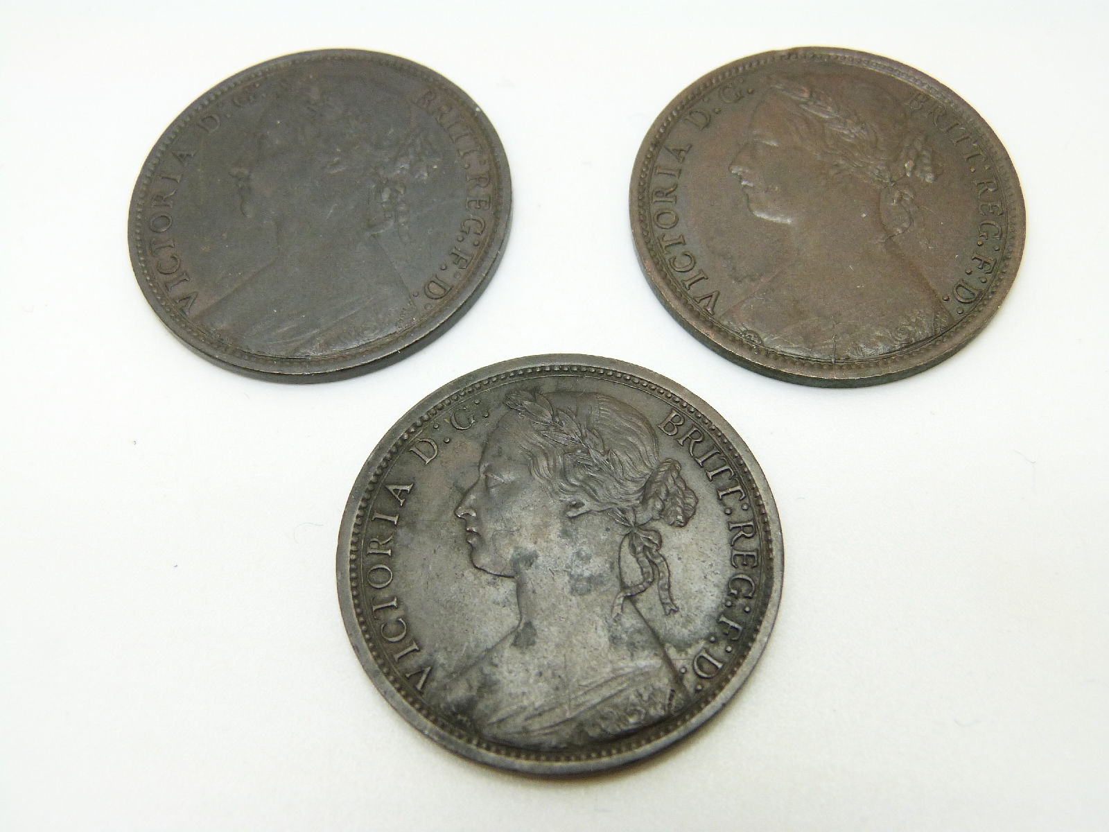 1874 Victorian later young head bronze penny together with an 1875 and an 1878 example, dark tone, - Image 2 of 2