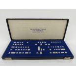 Cased miniature sterling silver miniature stamps each with details verso and marked sterling.