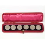 A cased set of six Edward VII hallmarked silver buttons with anchor decoration in original box,