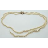 A double strand of cultured pearls with 9ct gold clasp