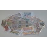 A collection of world banknotes from eight countries including Canada, India, Italy, Afghanistan,