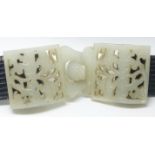 A 19th Century Chinese pierced and carved jade belt buckle in two parts, on later belt, 4.5 x 11 cm.