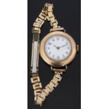 Swiss 9ct gold ladies wristwatch with Arabic numerals, gold hands, white enamel face and 15 jewel