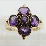 A 9ct gold ring set with amethysts, size L
