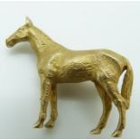 A 9ct gold brooch in the form of a horse, 12.1g