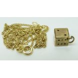 A 9ct gold necklace and a yellow metal dice charm/ pendant marked 333, 4.1g