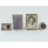 Three hallmarked silver photograph frames, the largest 18 x 13cm overall to take a 6 x 4 photo,