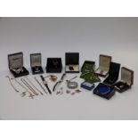 A collection of silver jewellery including a bracelet set with garnets, spoon, necklaces including