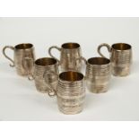 A 19thC set of six Italian white metal novelty tankards with gilt interiors, various marks 1832-