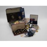 A collection of largely Royal Mint commemorative coins in presentation packs, includes Coronation