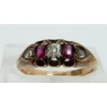 An 18ct gold ring set with diamonds and rubies, size K.