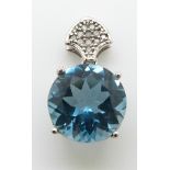 A 9ct white gold pendant set with a large blue topaz and diamonds, 2.4g