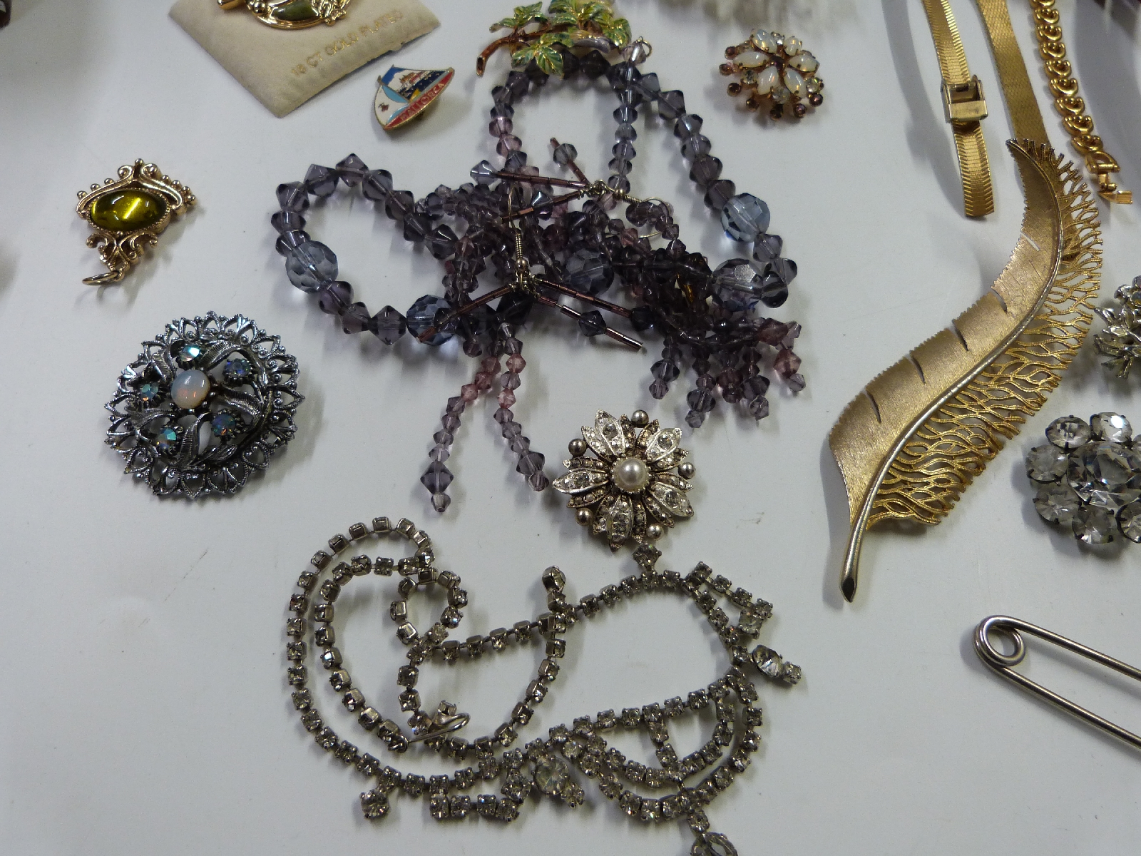 A collection of costume jewellery including large enamel brooches, marcasite, watch, necklaces, - Image 6 of 13