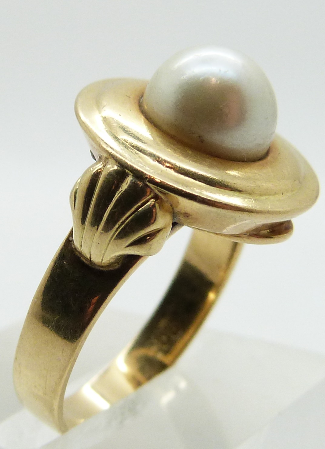A 14ct gold ring set with a cultured pearl, with shell design to each shoulder, size O - Image 2 of 2