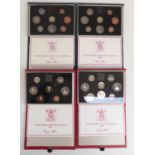 Four Royal Mint deluxe cased UK proof coin sets 1983, 1984, 1985 and 1986