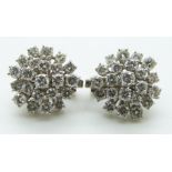 A pair of 18ct gold earrings each set with a large cluster of diamonds, totalling approximately