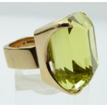 A 9ct gold ring set with a large emerald cut prasiolite, Sheffield 1975, maker J.S, size H