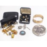 A collection of costume jewellery to include cufflinks, rolled gold bangle, Stratton compact etc