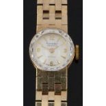 Rotary Maximus 9ct gold ladies wristwatch with gold hands and hour markers, cream dial, bevelled