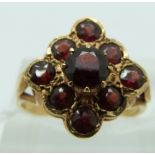 A 9ct gold ring set with garnets, size K