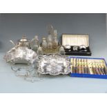A quantity of silver plate including cased plated cruet set, six bottle cruet, serving dishes etc