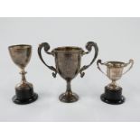Three various hallmarked silver trophy cups, largest 12cm tall, 76g, other two attached to bases,