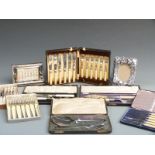 A quantity of cased silver plated cutlery, perpetual calendar, photograph frame etc