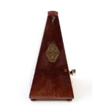 French metronome in mahogany case raised on bun feet