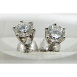A pair of 18ct white gold earrings set with a diamond of approximately 0.4ct to each