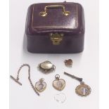 Three Victorian lockets, a section of yellow metal fob chain etc in a tooled leather jewellery box