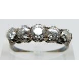 An 18ct gold ring set with five diamonds in a platinum setting, the diamonds approximately 0.5ct,