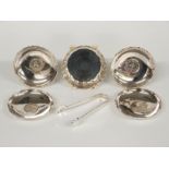 Five silver and white metal pin dishes, one with feature hallmarks to underside, the other four
