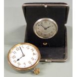 Travel alarm c1920s together with a similar 8 day Goliath style clock