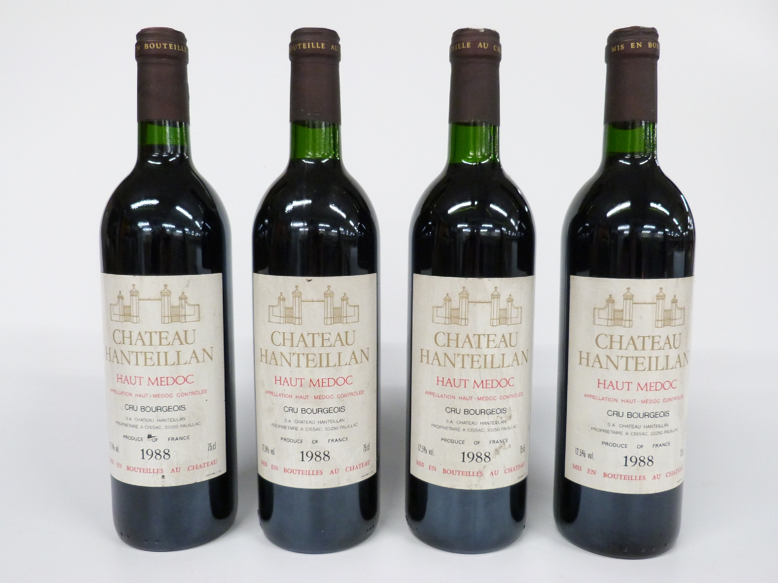 Four bottles of French red Bordeaux wine, Chateau Hanteillan 1988, 12.5%, 75cl