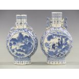 Two 19thC Chinese moon flasks decorated with floral landscapes, height 22cm