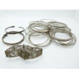 A hallmarked silver bangle, 29 Sudanese white metal bangles and a filigree bracelet