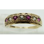 A 9ct gold ring set with rubies, size O