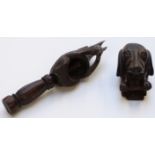 Black Forest carved squirrel nutcracker and a carved Dachshund wall mask, longest 20cm.