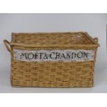 Large wicker basket named to side Moet & Chandon, length 77cm