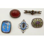 Three brooches variously set with butterfly wing and figures, tiger's eye, and an agate cabochon,