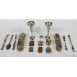 Two hallmarked silver trumpet vases, two hallmarked silver mounted brushes, plated and other vestas,